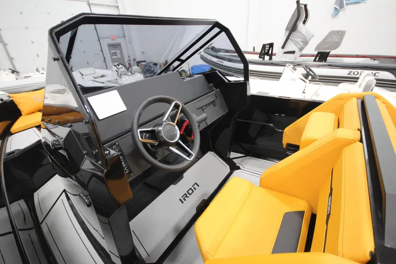 Slide: The Image of Modern Iron 767 boat interior with sleek design and vibrant yellow seating, 2026 model. - 19