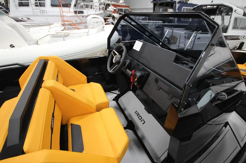 Slide: The Image of Interior of Iron 767 boat, 2026 model, featuring yellow seats and modern dashboard. - 20
