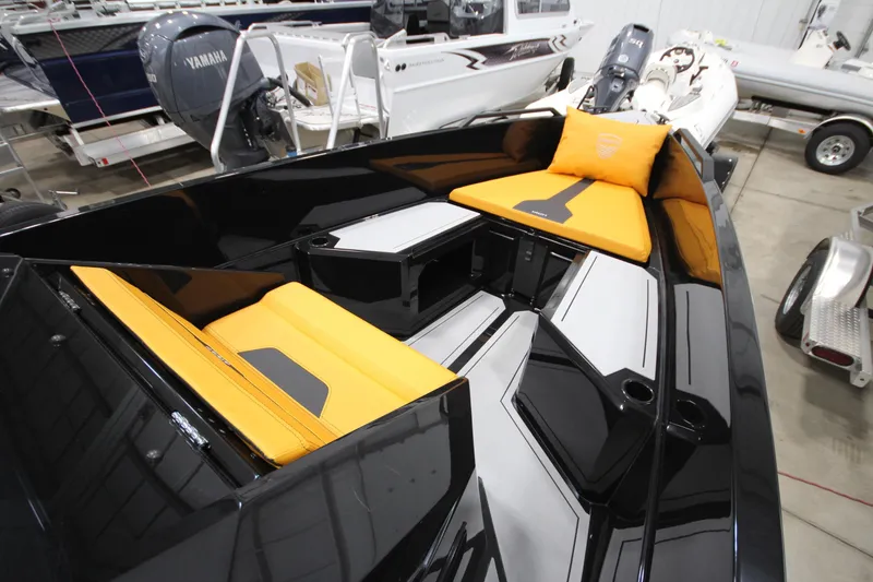 Slide: The Image of Modern Iron 767 boat interior with sleek black design and vibrant yellow seating, 2026 model. - 23