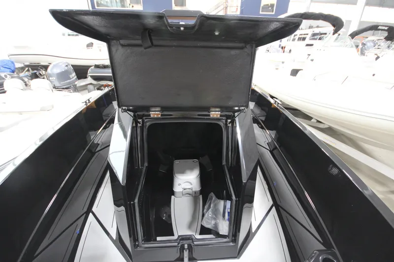 Slide: The Image of Open storage compartment on Iron 767 boat, showcasing interior space and design. - 25