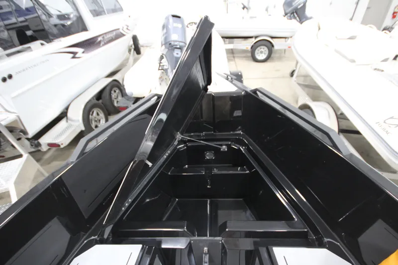 Slide: The Image of Open storage compartment on Iron 767 boat, showcasing sleek black interior design. - 27