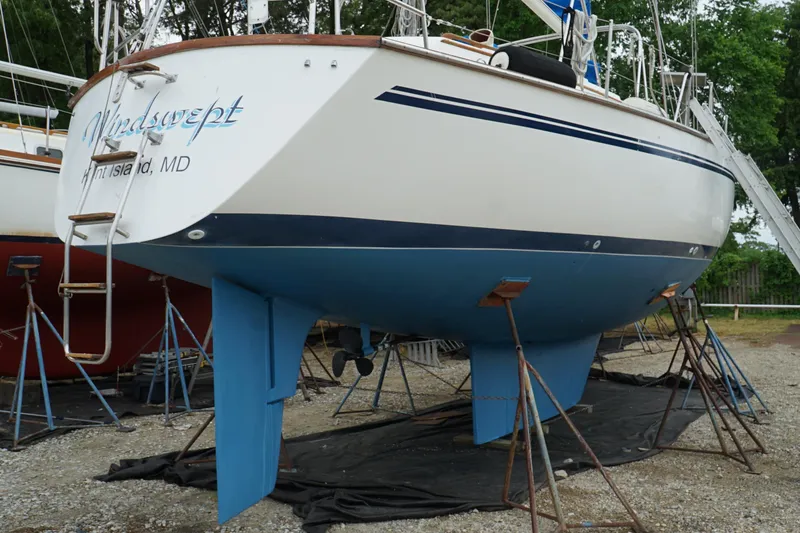 The Image of 1987 Morgan 43 sailboat on stands, named "Windswept," located in Kent Island, MD. - 1