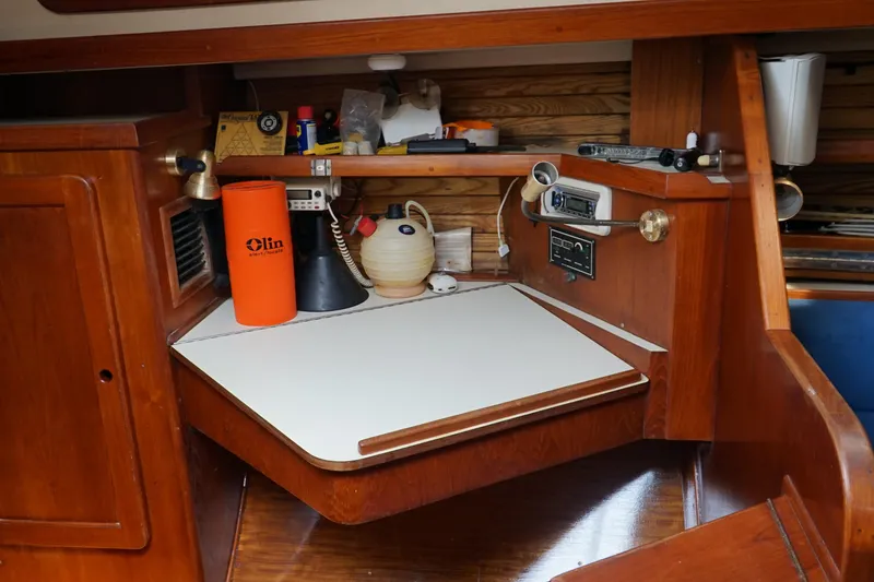 Slide: The Image of Interior of a 1987 Morgan 43 sailboat with a navigation station and equipment. - 18