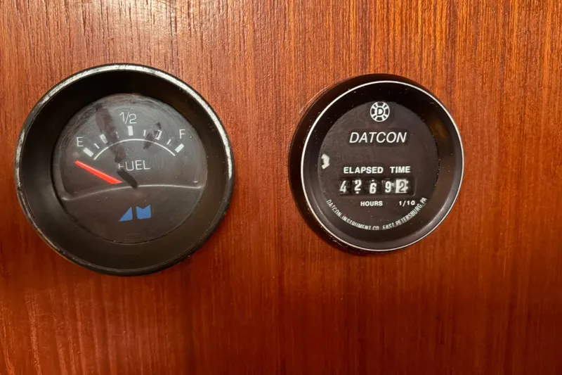 Slide: The Image of Fuel gauge and elapsed time meter on 1987 Morgan 43 wooden dashboard. - 23