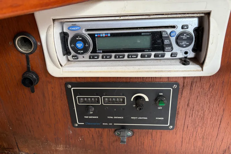 Slide: The Image of 1987 Morgan 43 boat dashboard with Jensen stereo and Datamarine model 631 display. - 24
