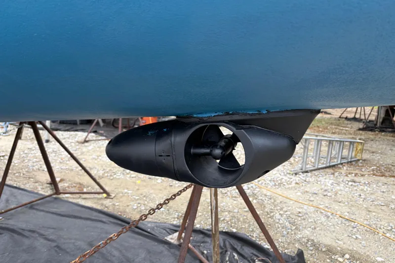 Slide: The Image of 1987 Morgan 43 boat propeller and hull on stands in a shipyard. - 28