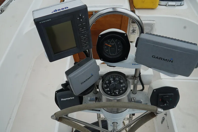 Slide: The Image of Cockpit of 1987 Morgan 43 sailboat with navigation instruments and steering wheel. - 7