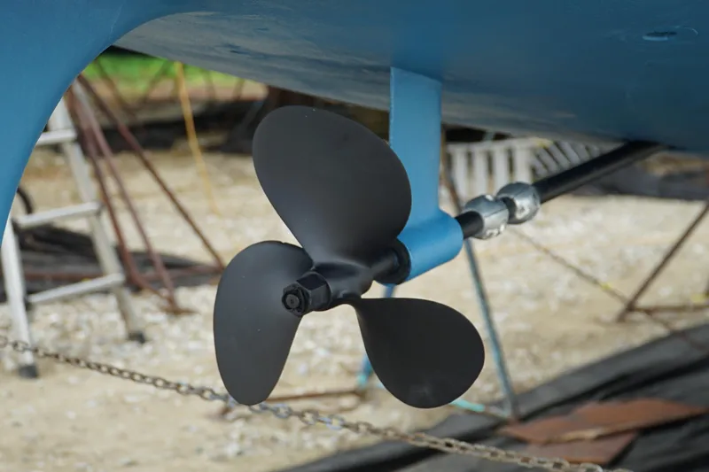 Slide: The Image of Propeller of a 1987 Morgan 43 sailboat, displayed on a stand outdoors. - 9