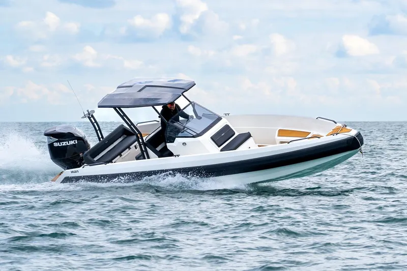 The Image of 2026 Iron 767 boat cruising on open water with Suzuki engine. - 1