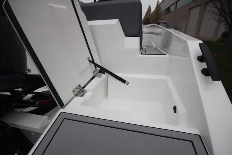Slide: The Image of Open storage compartment on Iron 767 boat, 2026 model, showcasing sleek design and functionality. - 11