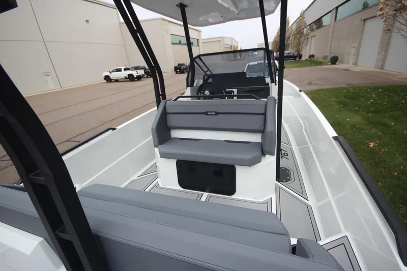 Slide: The Image of Modern Iron 767 boat interior, 2026 model, featuring sleek gray seating and spacious deck. - 13