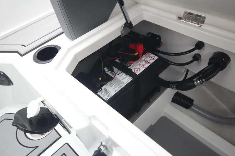 Slide: The Image of Battery compartment of Iron 767 boat model, showcasing wiring and secure installation, 2026. - 17