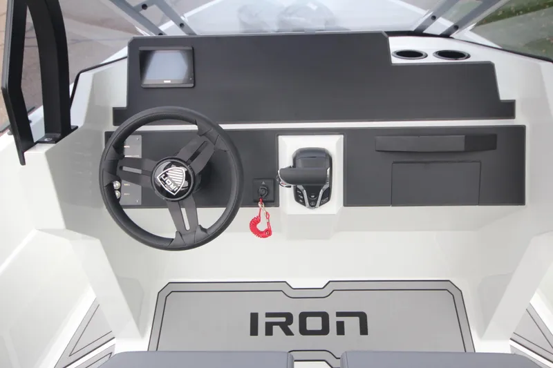 Slide: The Image of Steering console of Iron 767 boat, featuring modern controls and sleek design, 2026 model. - 20
