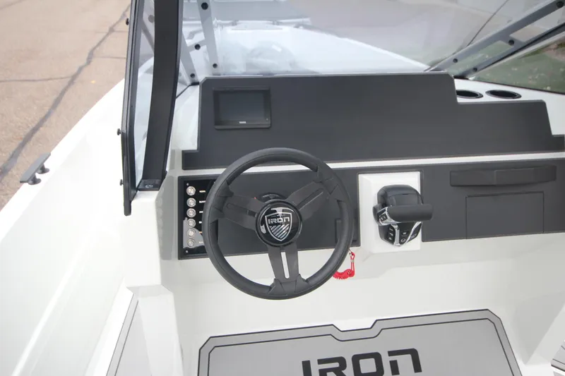 Slide: The Image of Steering console of Iron 767 boat, 2026 model, featuring modern controls and dashboard. - 21