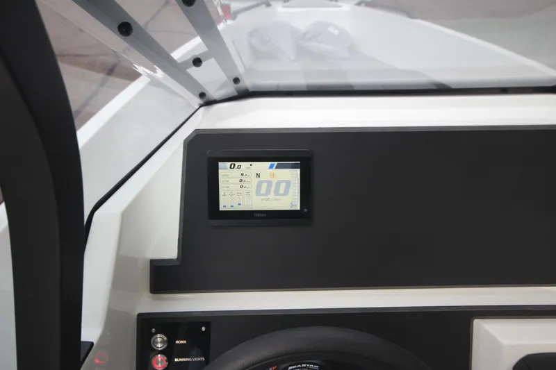 Slide: The Image of Dashboard of Iron 767 boat, featuring digital display and controls, 2026 model. - 27