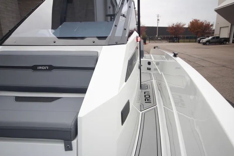 Slide: The Image of 2026 Iron 767 boat with sleek design and modern features, docked outdoors. - 33