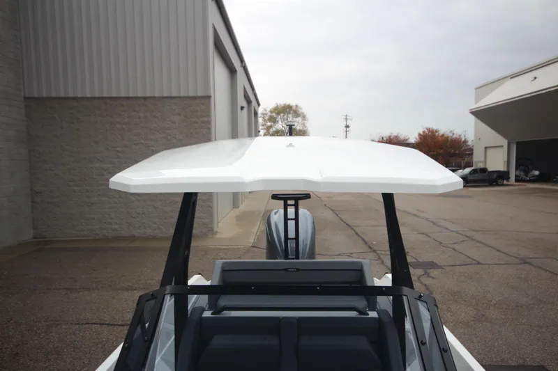 Slide: The Image of Modern Iron 767 boat with sleek design, photographed outdoors, showcasing its innovative features. - 34