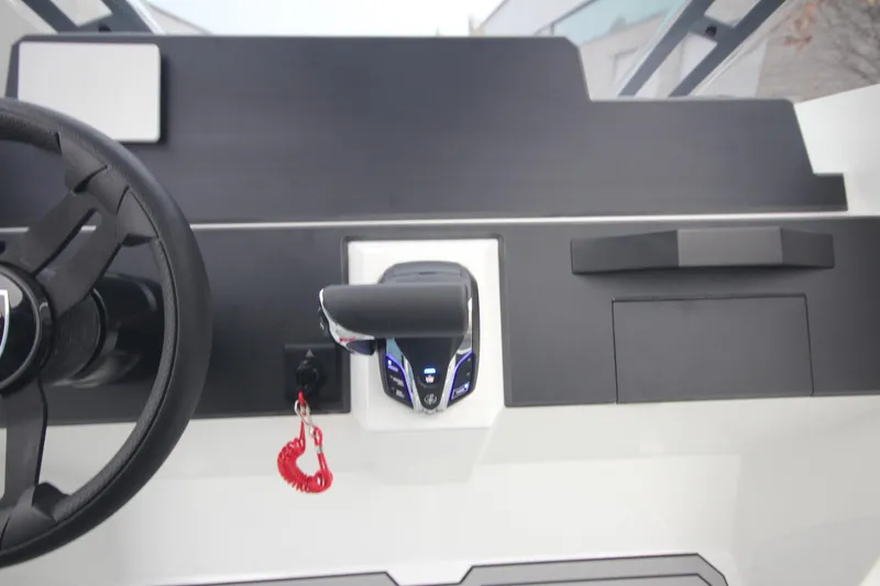 Slide: The Image of Steering console of Iron 767 boat, featuring modern controls and sleek design, 2026 model. - 41