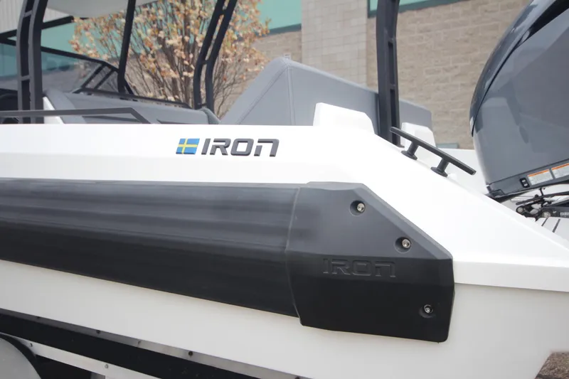 Slide: The Image of 2026 Iron 767 boat side view with logo and sleek design. - 5