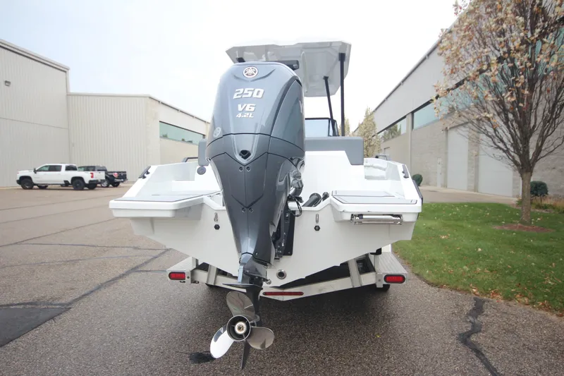 Slide: The Image of Rear view of Iron 767 boat with powerful V6 engine, parked outdoors. - 6