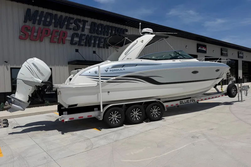 Slide: The Image of 2022 Formula 310 Sun Sport boat on trailer at Midwest Boating Super Center. - 11