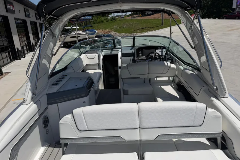 Slide: The Image of 2022 Formula 310 Sun Sport boat interior with luxurious seating and modern dashboard. - 12