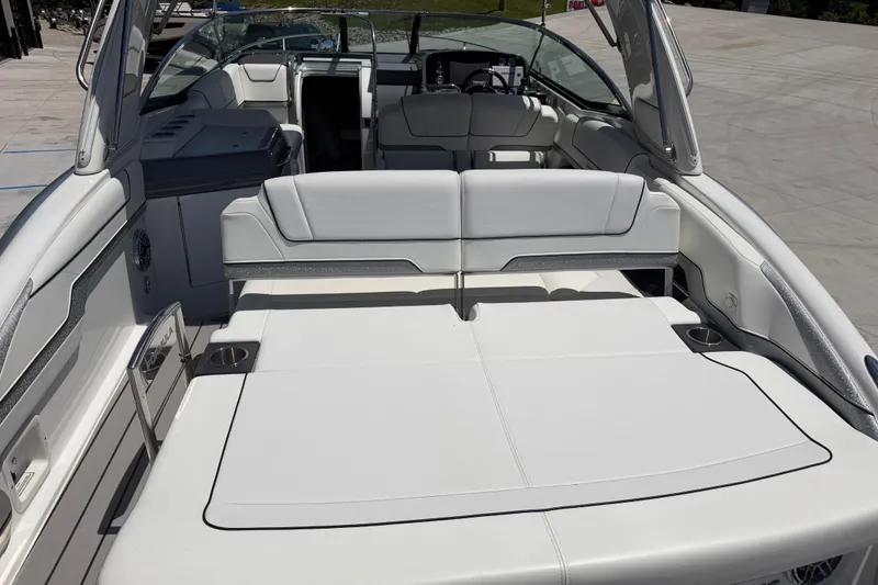 Slide: The Image of 2022 Formula 310 Sun Sport boat interior with luxurious white seating and modern design. - 13
