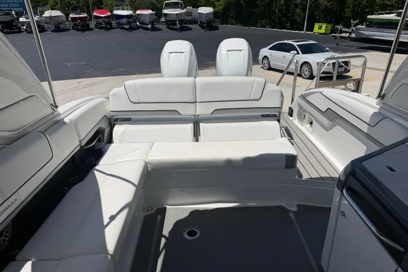 Slide: The Image of 2022 Formula 310 Sun Sport boat interior with luxurious seating and sleek design. - 14