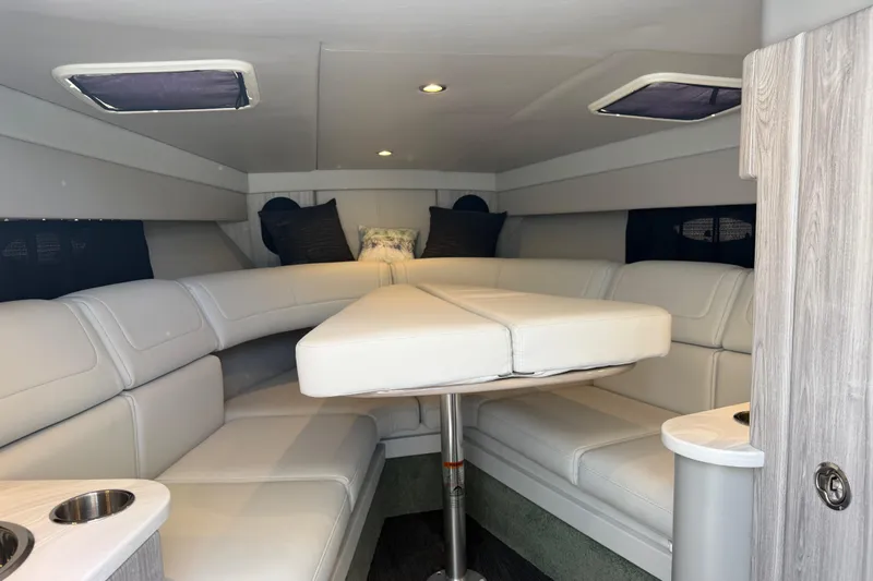 Slide: The Image of 2022 Formula 310 Sun Sport cabin with white leather seating and modern interior design. - 19