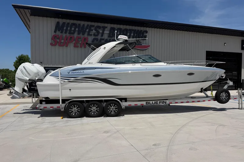 Slide: The Image of 2022 Formula 310 Sun Sport boat on trailer at Midwest Boating Super Center. - 2