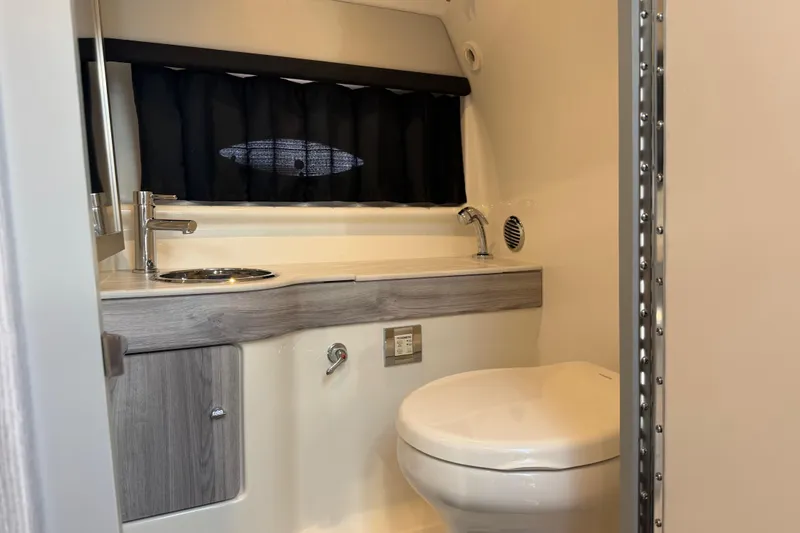 Slide: The Image of 2022 Formula 310 Sun Sport boat bathroom with modern fixtures and sleek design. - 22
