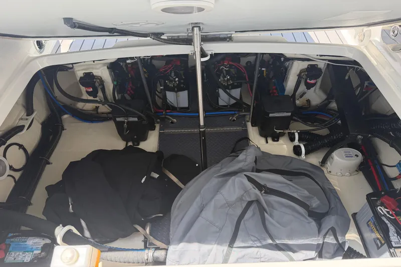 Slide: The Image of Engine compartment of a 2022 Formula 310 Sun Sport boat with visible wiring and equipment. - 23