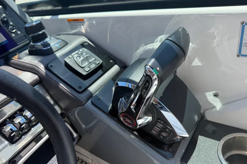 Slide: The Image of Control panel of a 2022 Formula 310 Sun Sport boat, featuring advanced navigation controls. - 27