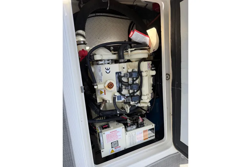 Slide: The Image of Engine compartment of 2022 Formula 310 Sun Sport boat, showcasing mechanical components. - 29
