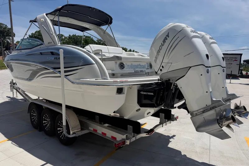 Slide: The Image of 2022 Formula 310 Sun Sport boat on trailer with dual Mercury outboard engines. - 6