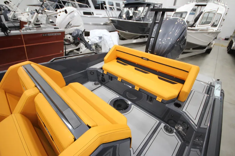 Slide: The Image of Modern IRON 767 boat interior with vibrant orange seating, showcasing sleek design and craftsmanship. - 14