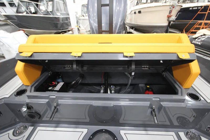 Slide: The Image of Open storage compartment on IRON BOATS IRON 767, 2026 model, with yellow seating. - 15