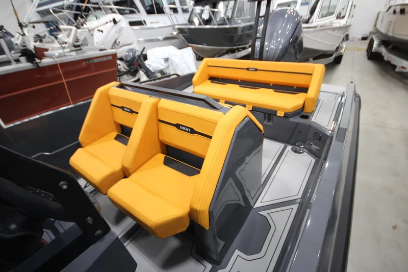 Slide: The Image of Modern IRON 767 boat interior with vibrant orange seating, showcasing sleek design and comfort. - 18