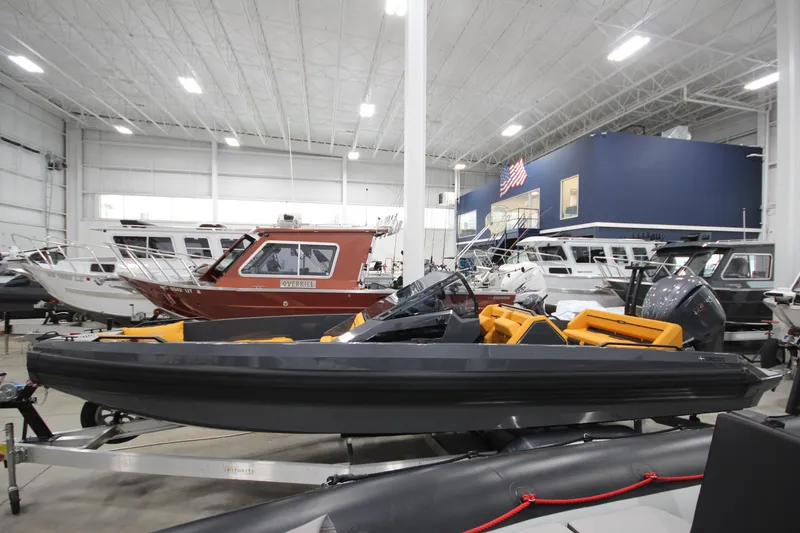 Slide: The Image of 2026 IRON BOATS IRON 767 displayed in a spacious indoor showroom. - 4