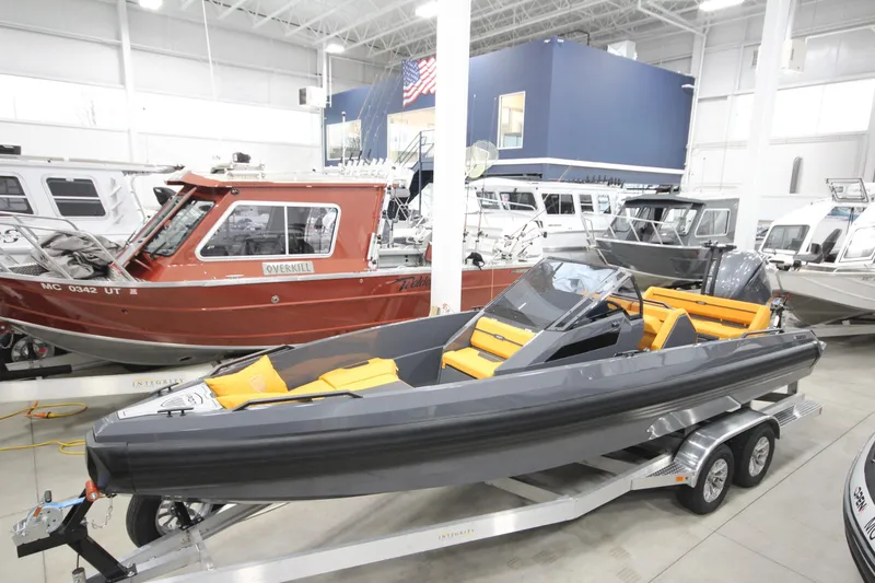 Slide: The Image of 2026 IRON BOATS IRON 767 displayed in a showroom, featuring sleek design and vibrant seating. - 7