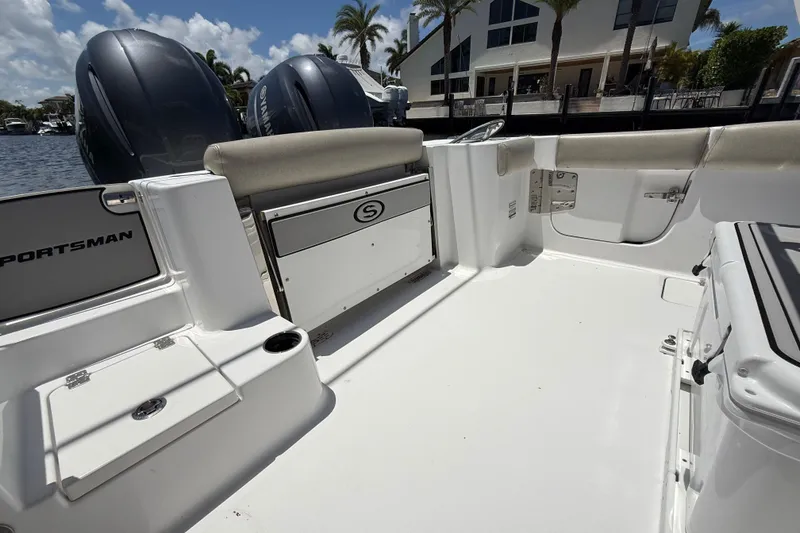 Slide: The Image of 2021 Sportsman Open 252 Center Console boat interior with dual engines and seating. - 4