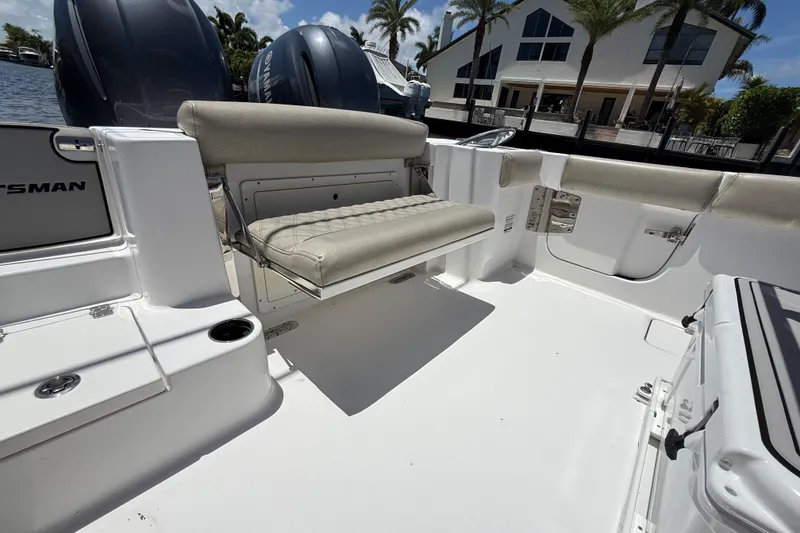 Slide: The Image of 2021 Sportsman Open 252 Center Console boat interior with seating and storage. - 5
