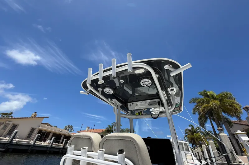 Slide: The Image of 2021 Sportsman Open 252 Center Console boat under clear blue sky. - 9