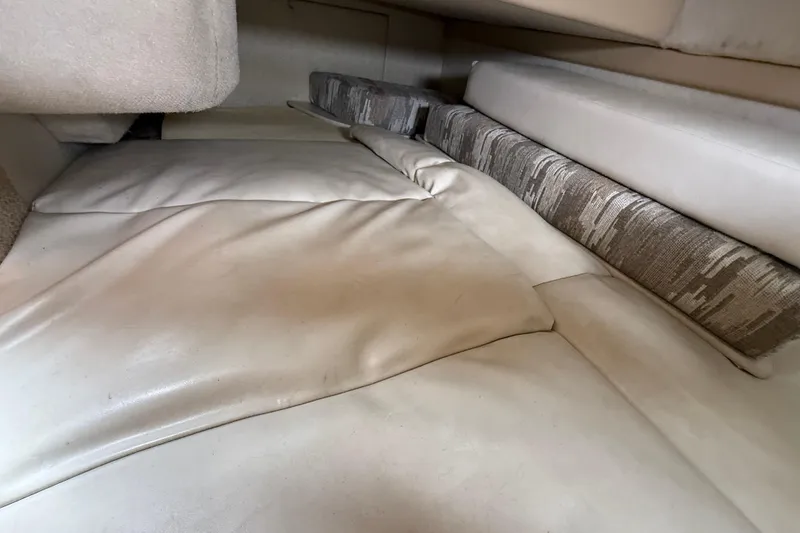 Slide: The Image of Interior cabin view of 1997 Bayliner 3255 Avanti, featuring cushioned seating and upholstery. - 17