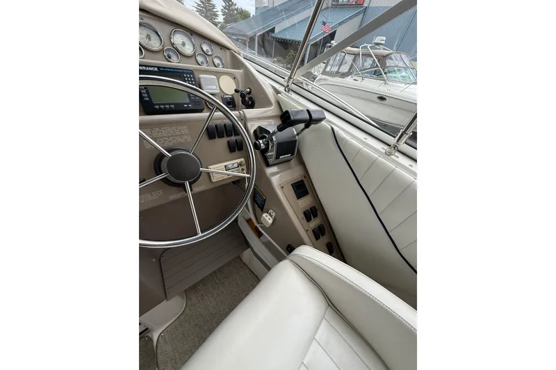 Slide: The Image of Interior view of 1997 Bayliner 3255 Avanti boat cockpit with steering wheel and controls. - 20
