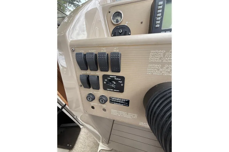 Slide: The Image of Control panel of a 1997 Bayliner 3255 Avanti boat with switches and dials. - 21