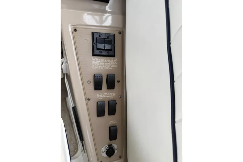 Slide: The Image of Control panel of a 1997 Bayliner 3255 Avanti boat with switches and instructions. - 23