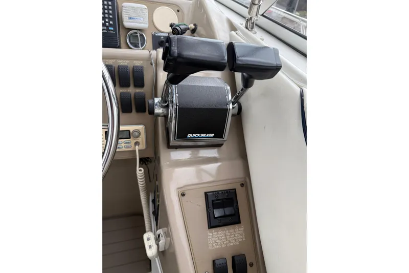 Slide: The Image of Control panel of a 1997 Bayliner 3255 Avanti boat with Quicksilver throttle. - 24
