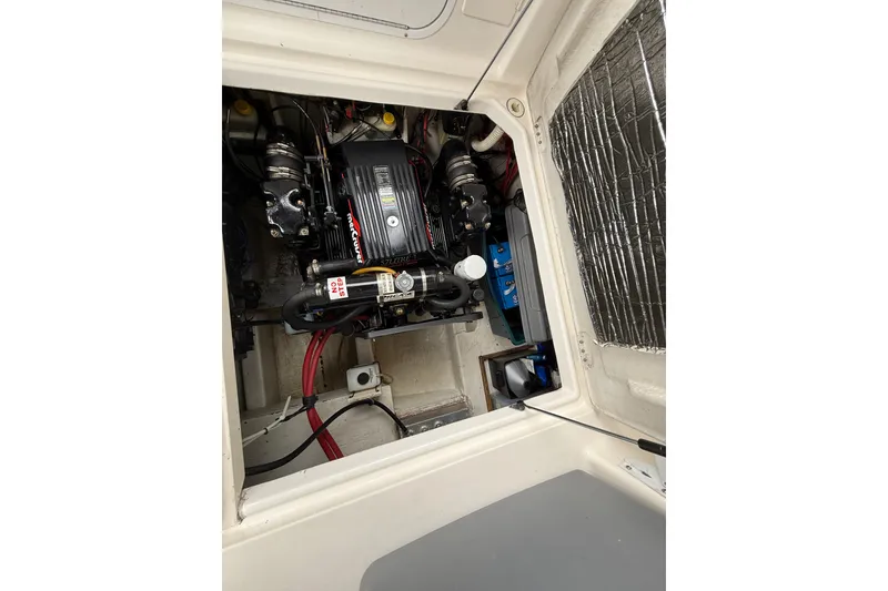 Slide: The Image of Engine compartment of a 1997 Bayliner 3255 Avanti boat, featuring a MerCruiser engine. - 7