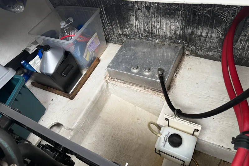 Slide: The Image of Engine compartment of 1997 Bayliner 3255 Avanti with maintenance supplies and wiring. - 9
